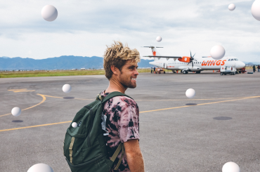 Dylan standing near an airport runway